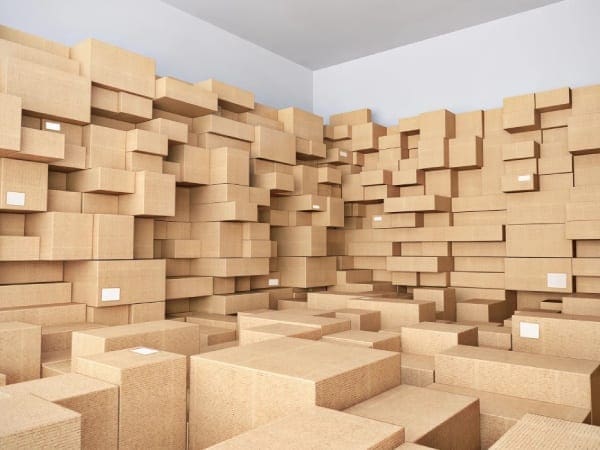 A room filled with lots of boxes and a wall.